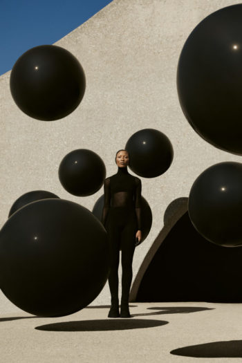 STYLIST'S OWN のボディスーツ、WOLFORD のストッキング、CRAIG PORT のバラクラバ、THAT SHOE LADY のシューズ